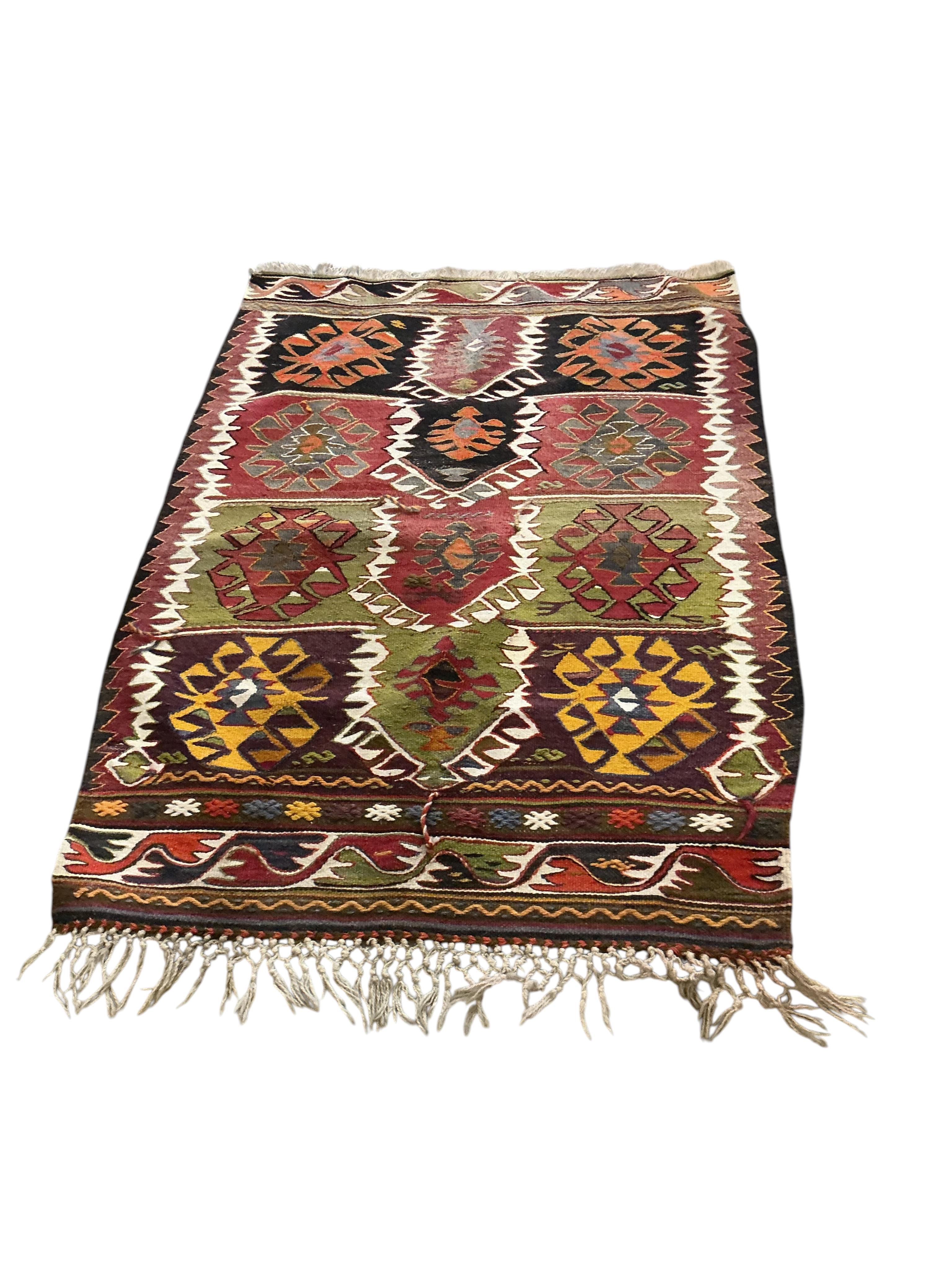 A Kilim polychrome flatweave rug, 140 x 105cm